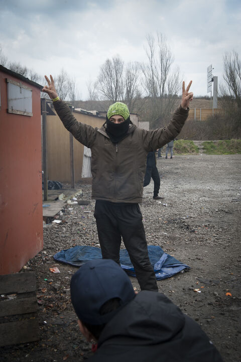  The Grande Synthe camp, the only humanitarian camp in France, a few days from the first year of its opening (March 7, 2017). Open following the closure of the Jungle in Calais to welcome migrants. Portrait of a migrant trying to keep moral and hope in front of the camera. Grande Synthe. France 2017.